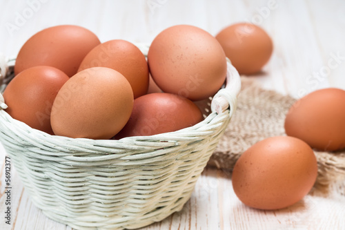Chicken eggs in a wicker basket