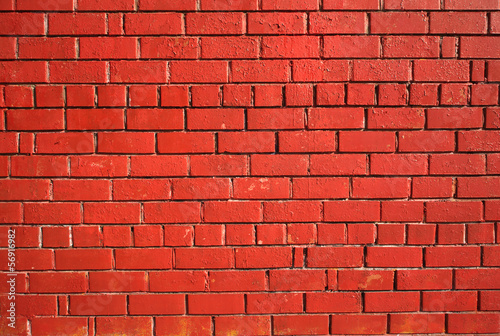 Red brick wall as background front view closeup