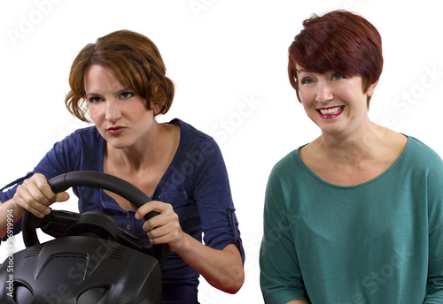 two young female driving on a road trip with white background photo