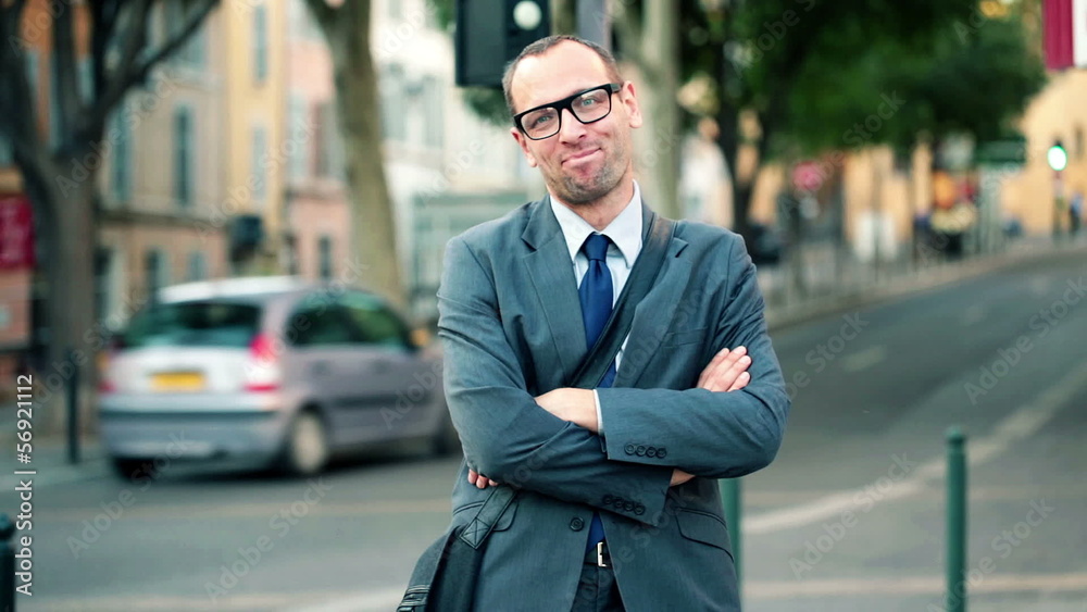 Portrait of young successful confident businessman in the city