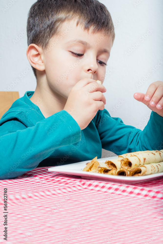 Boy eating pancakes Boy eating pancakes