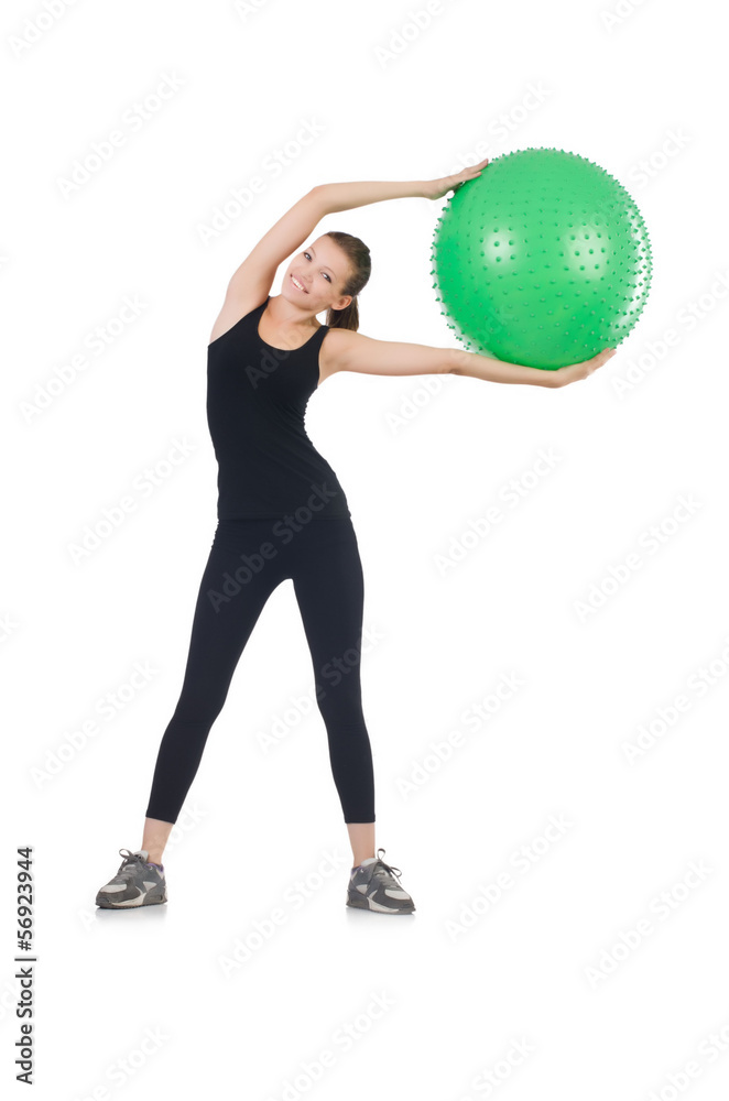 Young woman with ball exercising on whitee