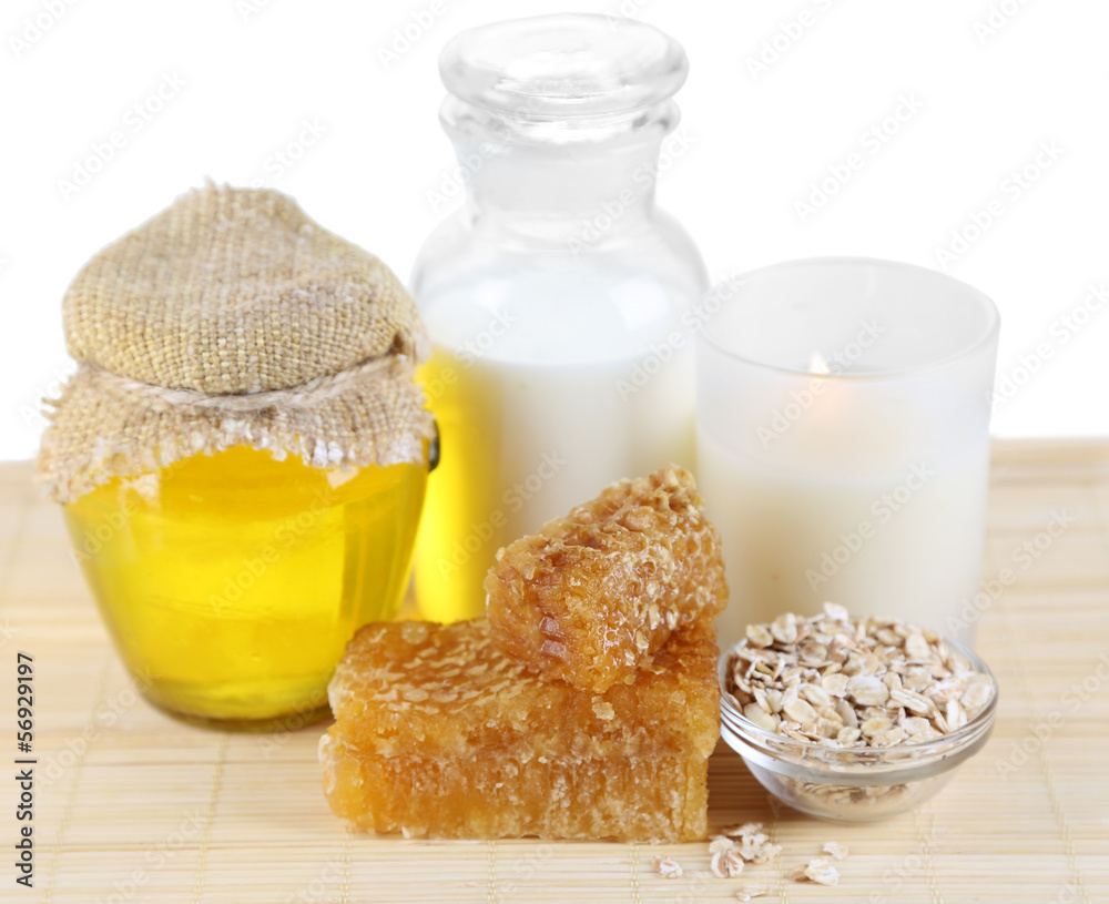 Honey and milk spa with oils and honey isolated on white Honey and milk spa with oils and honey isolated on white