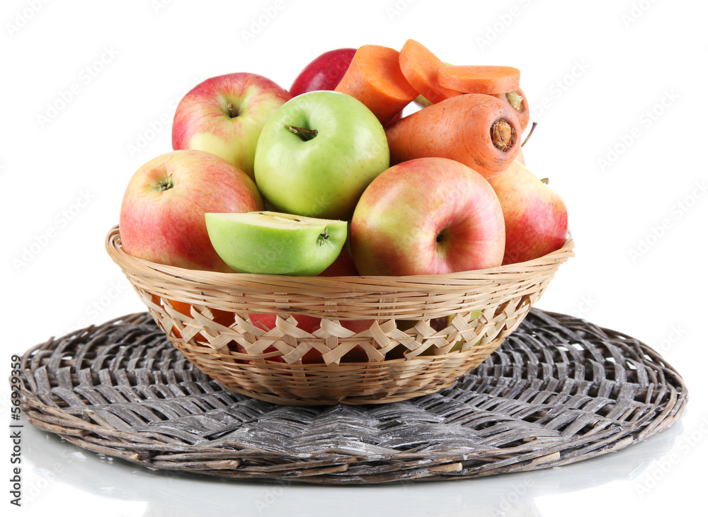 Sweet apples and carrots in basket isolated on white Sweet apples and carrots in basket isolated on white