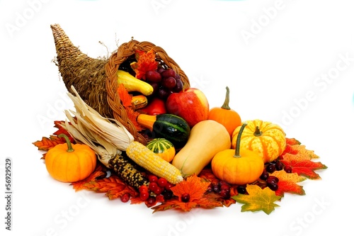 Harvest or Thanksgiving cornucopia filled with vegetables photo