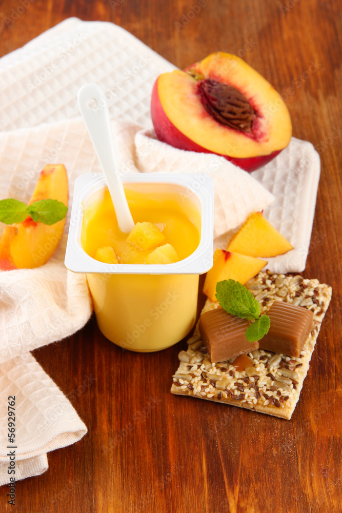 Tasty yogurt with pieces of fresh fruits, cookies and flakes,on Tasty yogurt with pieces of fresh fruits, cookies and flakes,on
