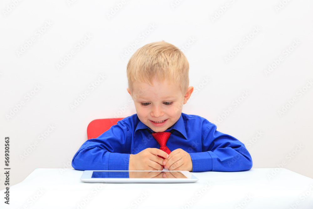 portrait of business child looking at touch pad portrait of business child looking at touch pad