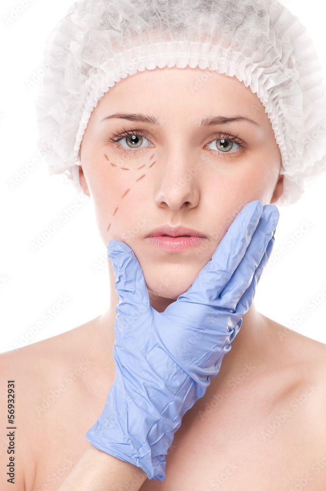 Beautician draw correction lines on woman face Beautician draw correction lines on woman face