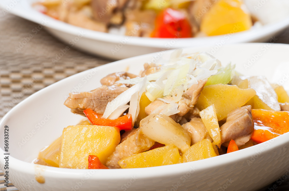 braised pork in curry sauce with potatoes, onions and carrots braised pork in curry sauce with potatoes, onions and carrots