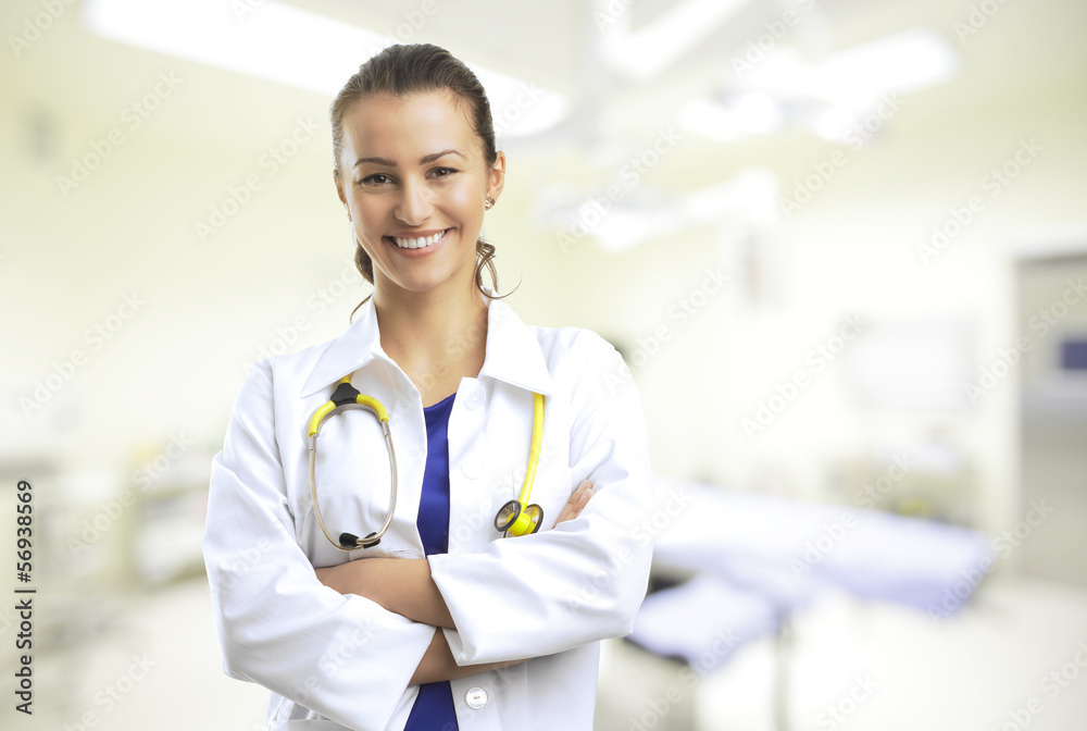 Close-up of a female doctor smiling with arms crossed Close-up of a female doctor smiling with arms crossed