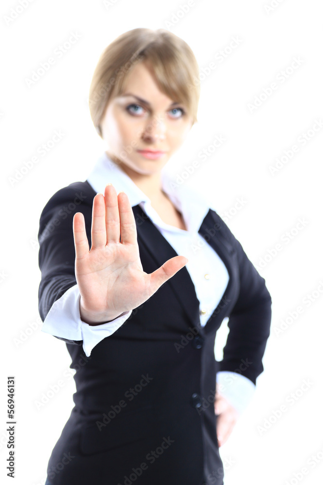Business woman making stop sign over white, focus on hand Business woman making stop sign over white, focus on hand