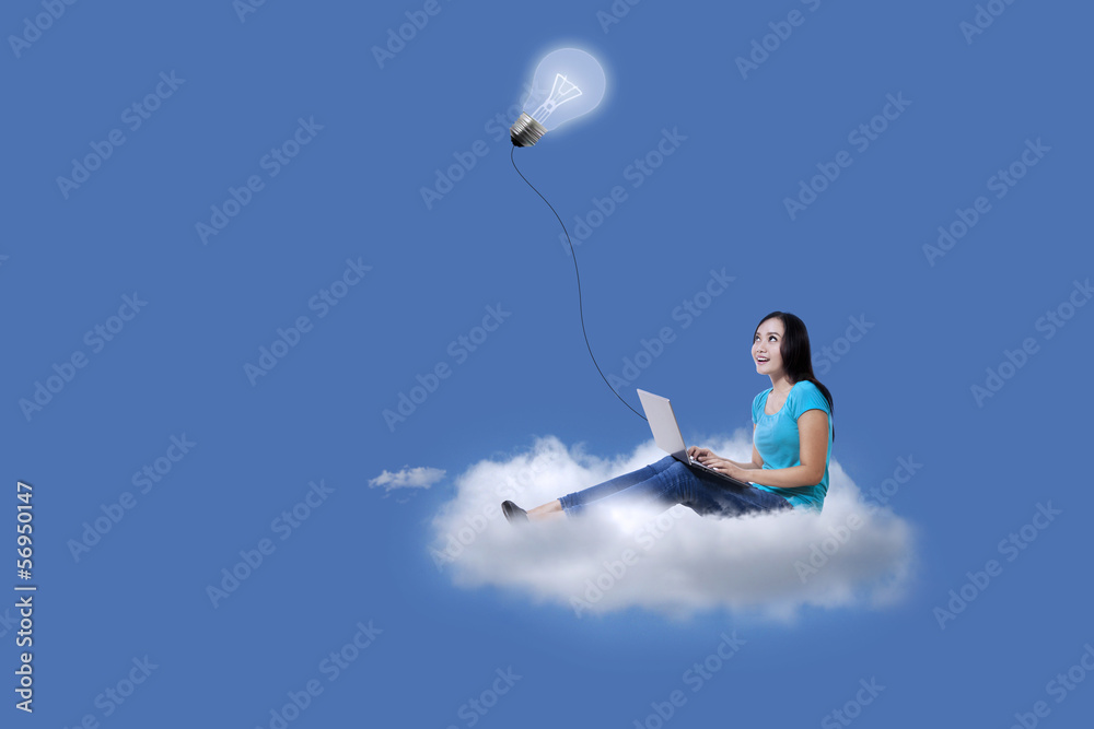 Asian student using laptop over cloud Asian student using laptop over cloud