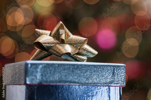 Blue gift box under a Christmas tree © eurobanks
