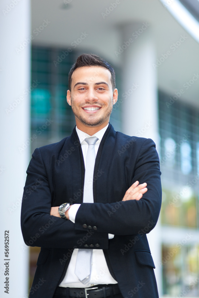 Young businessman portrait in an urban setting Young businessman portrait in an urban setting