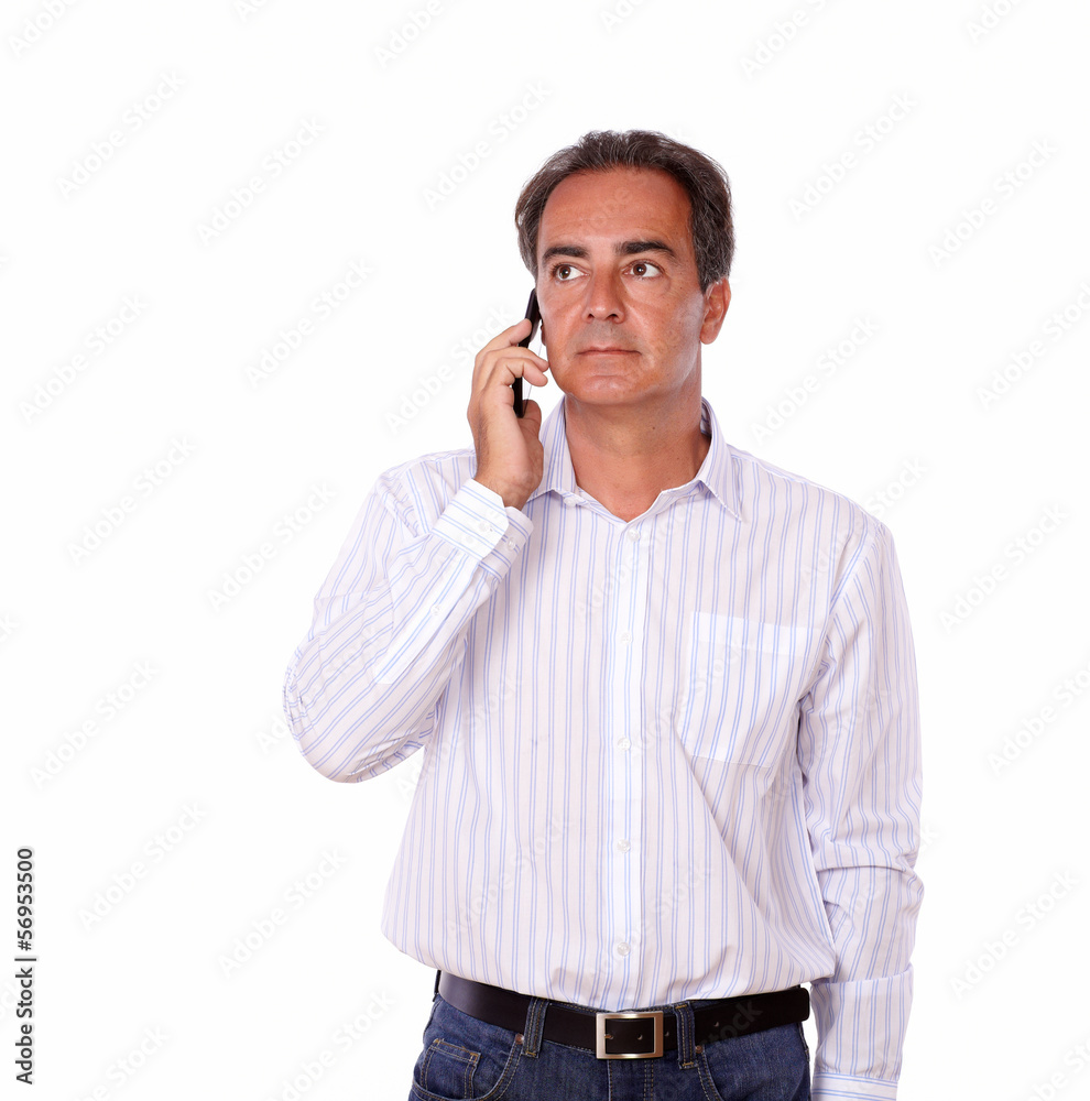 Charismatic male speaking on his cellphone Charismatic male speaking on his cellphone