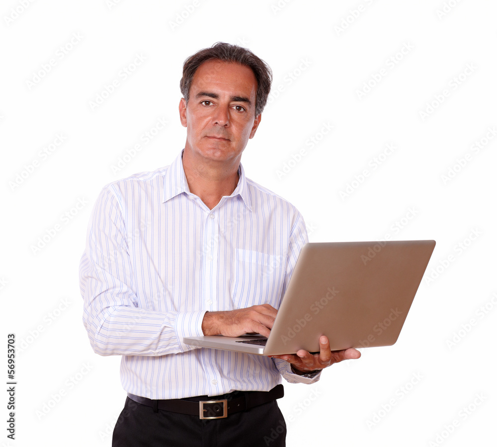 Senior man with laptop looking at you Senior man with laptop looking at you