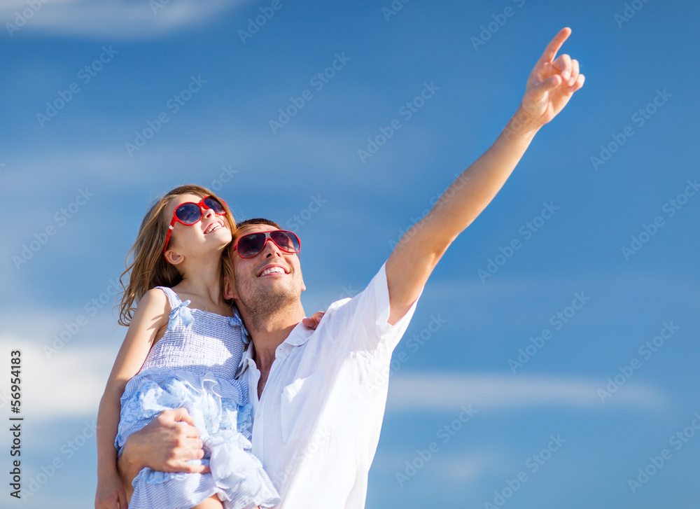 happy father and child in sunglasses over blue sky happy father and child in sunglasses over blue sky