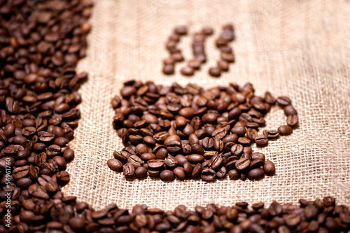 aromatic and fresh coffee beans on vintage background