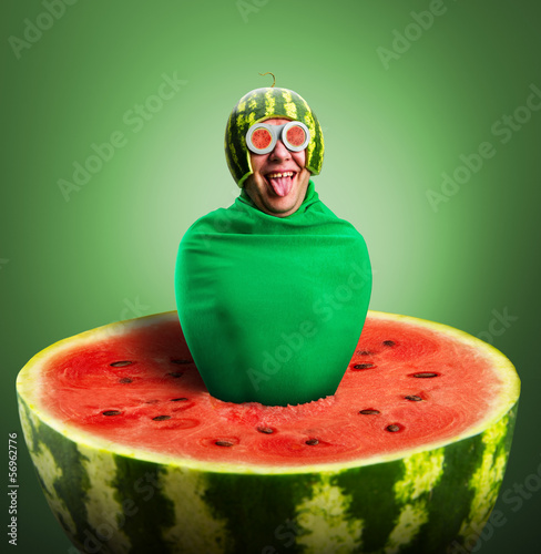 Funny man with watermelon helmet and googles photo