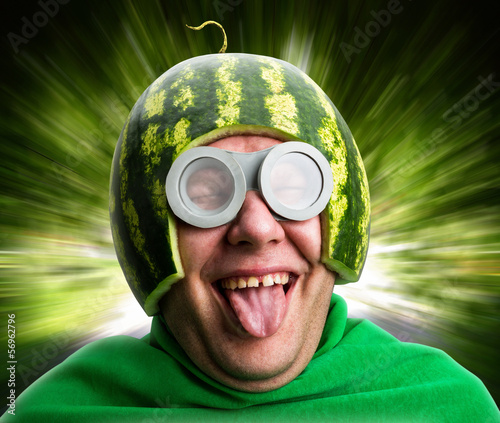 Funny man with watermelon helmet and googles