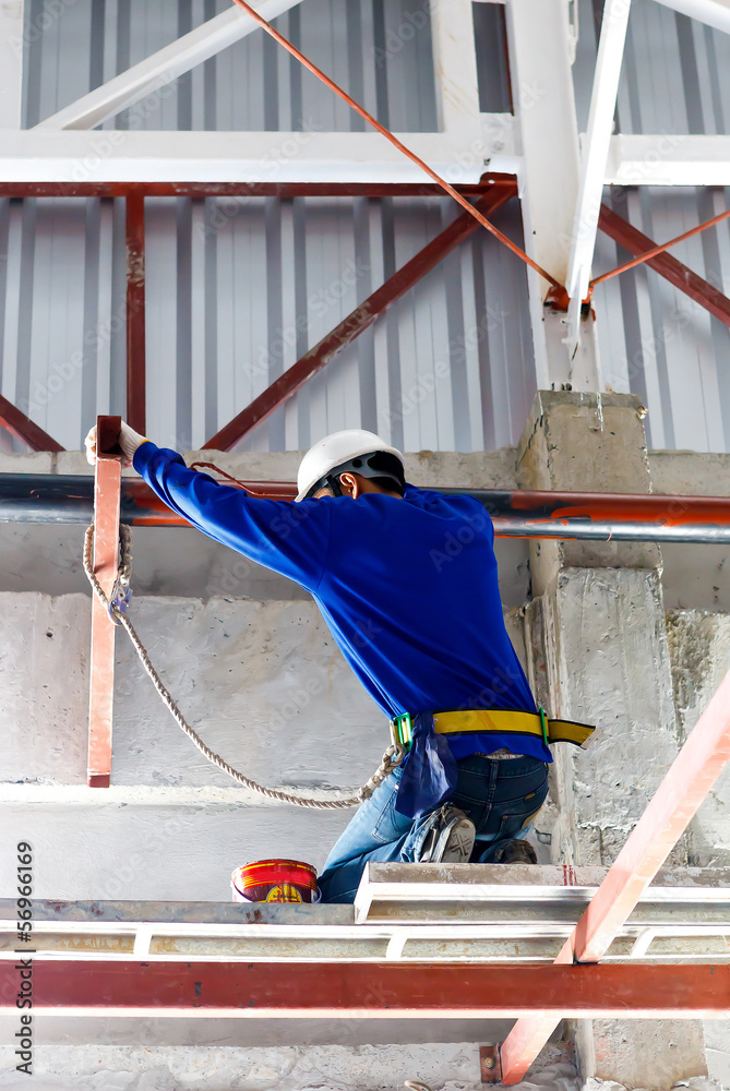 labor working in construction site for roof prepare