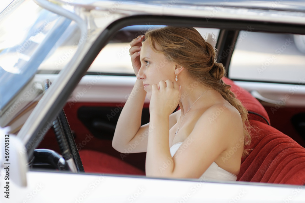 Beautiful young bride portrait in a wedding car Beautiful young bride portrait in a wedding car