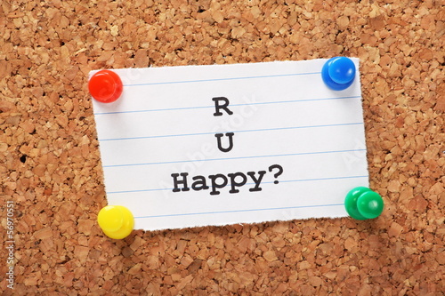 Are You Happy note pinned to a cork board