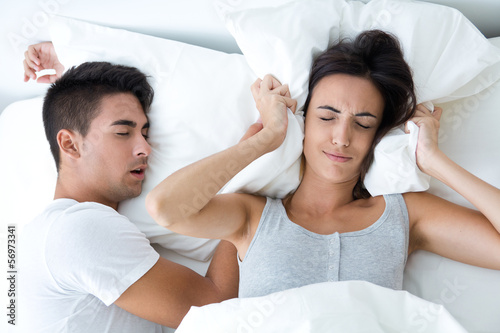 Canvas Print woman who can not sleep because her husband snores