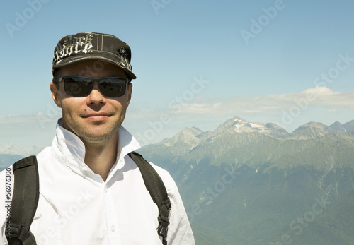 Man on background of Caucasus mountain range in Krasnaya Polyana © Julia Mashkova