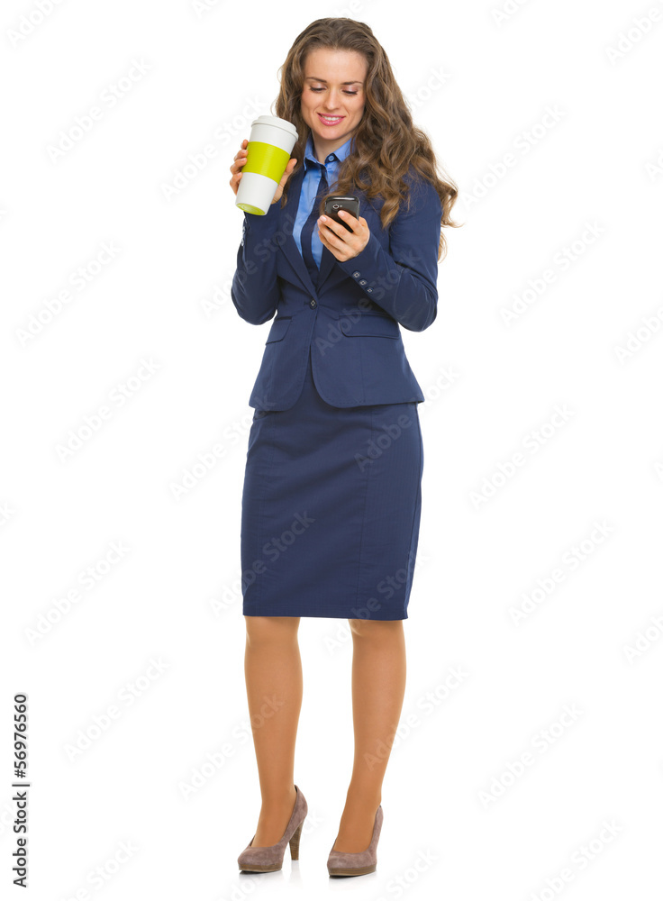 Full length portrait of business woman with cup of hot beverage Full length portrait of business woman with cup of hot beverage