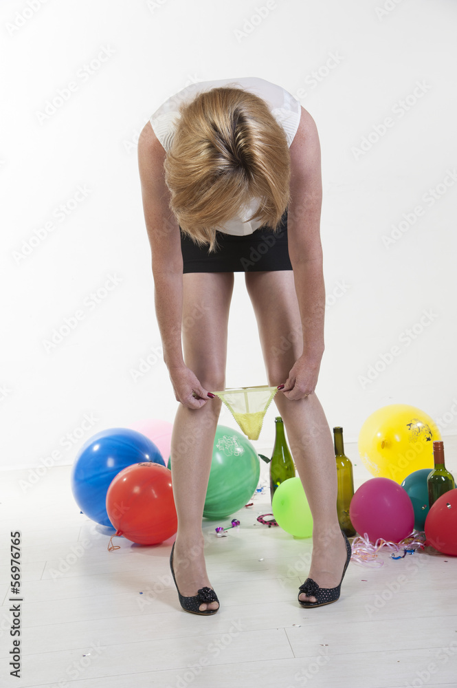 Woman removing underwear at office party Stock Photo | Adobe Stock