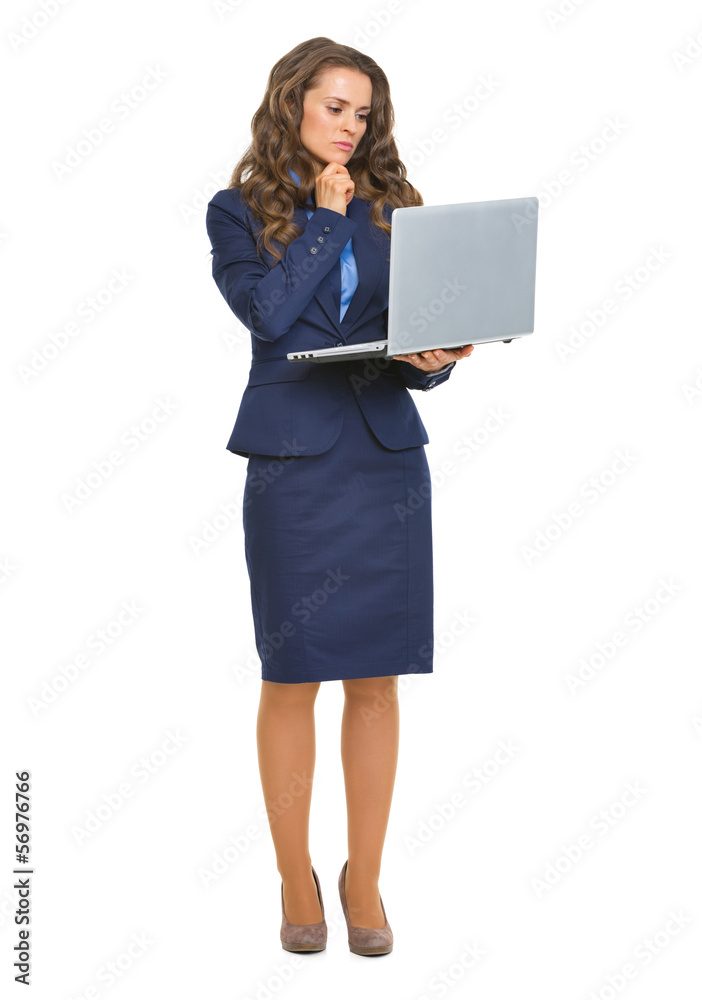 Full length portrait of thoughtful business woman with laptop Full length portrait of thoughtful business woman with laptop