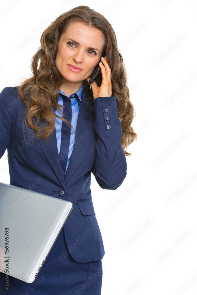 Business woman with laptop talking cell phone Business woman with laptop talking cell phone