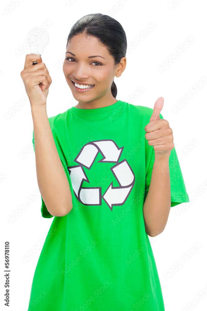 Smiling model wearing recycling tshirt holding light bulb
