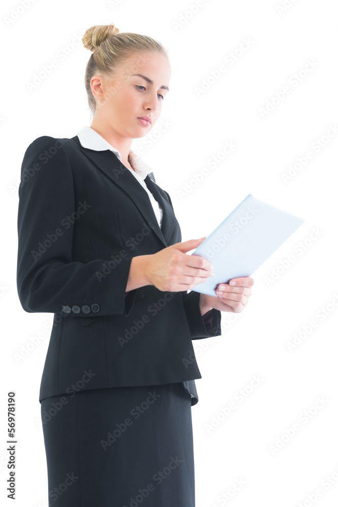 Concentrated young businesswoman working with her tablet Concentrated young businesswoman working with her tablet
