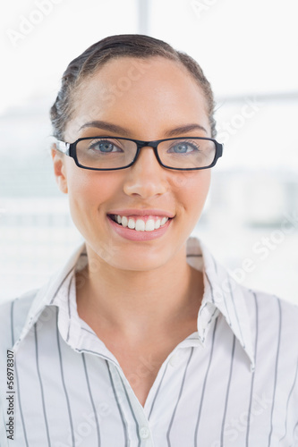 Smart smiling businesswoman with glasses
