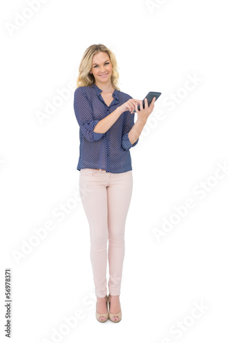 Cheerful pretty blonde holding calculator