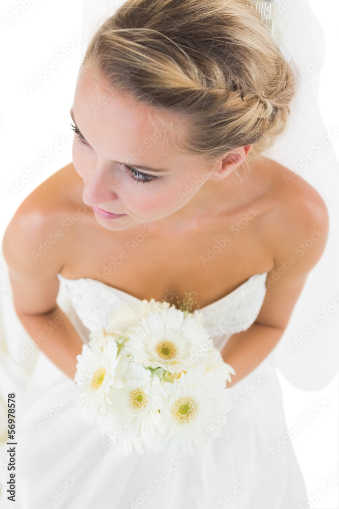 High angle view of thoughtful bride carrying a bouquet High angle view of thoughtful bride carrying a bouquet
