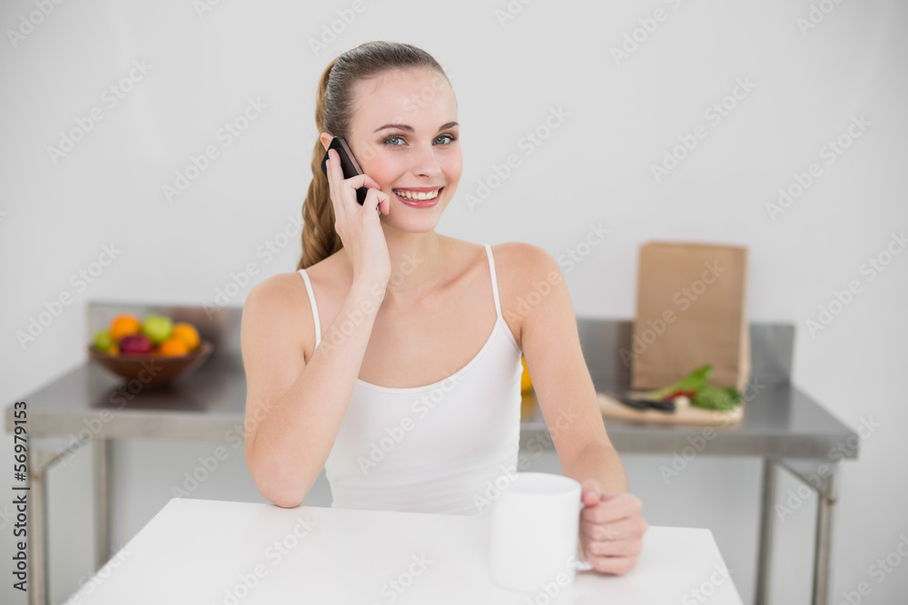 Smiling young woman making a phone call Smiling young woman making a phone call