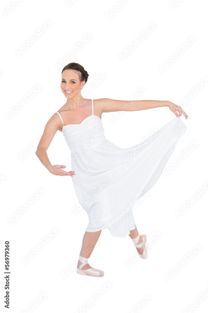 Happy young ballet dancer posing with leg back Happy young ballet dancer posing with leg back