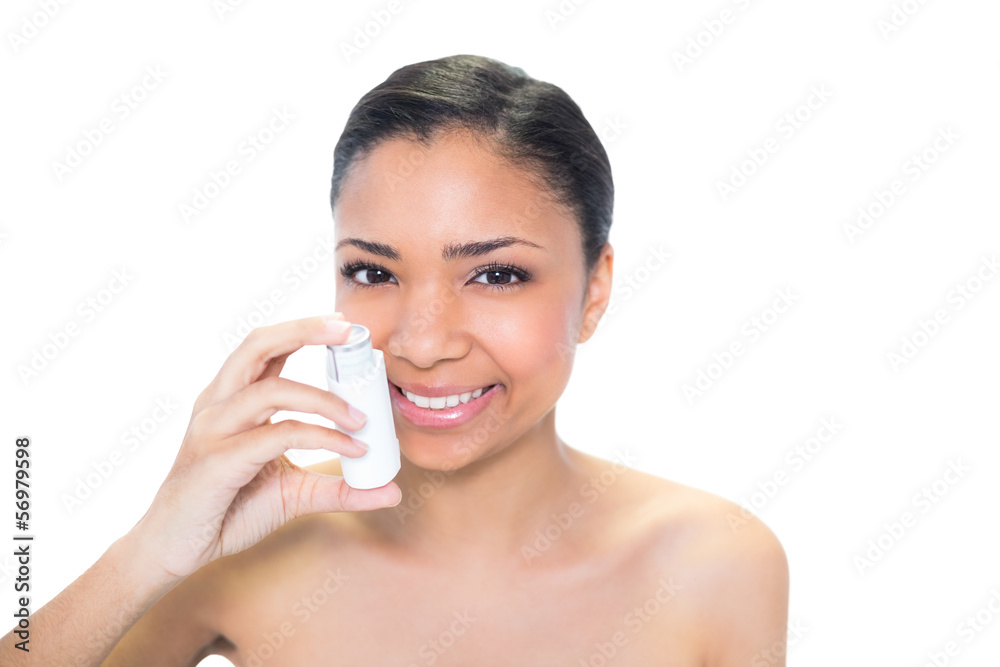 Cheerful young dark haired model using athma inhaler Cheerful young dark haired model using athma inhaler