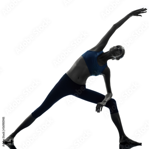 woman exercising stretching triangle pose yoga