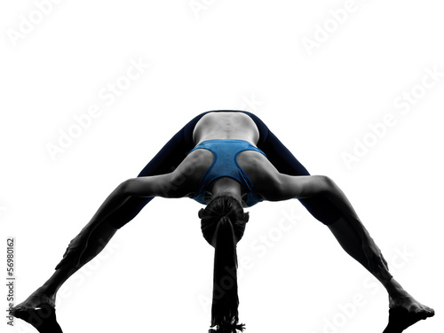woman exercising yoga stretching legs warm up