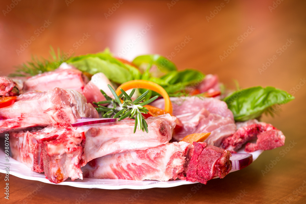 fresh pork with seasonal vegetables on the plate