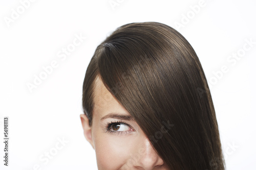 Young woman with hair covering face