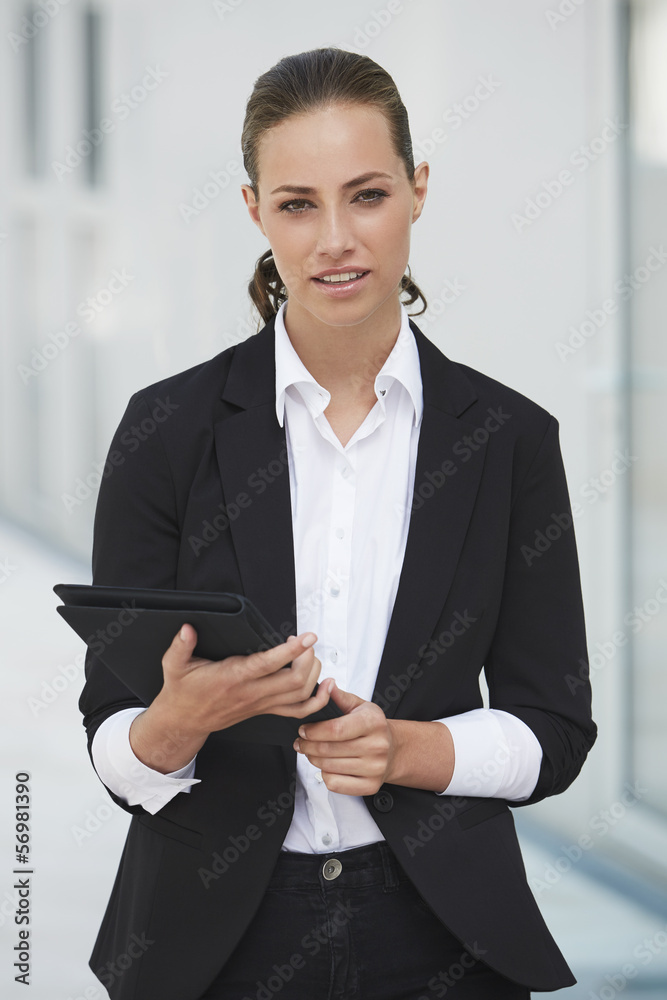 Portrait of young businesswoman holding digital tablet Portrait of young businesswoman holding digital tablet