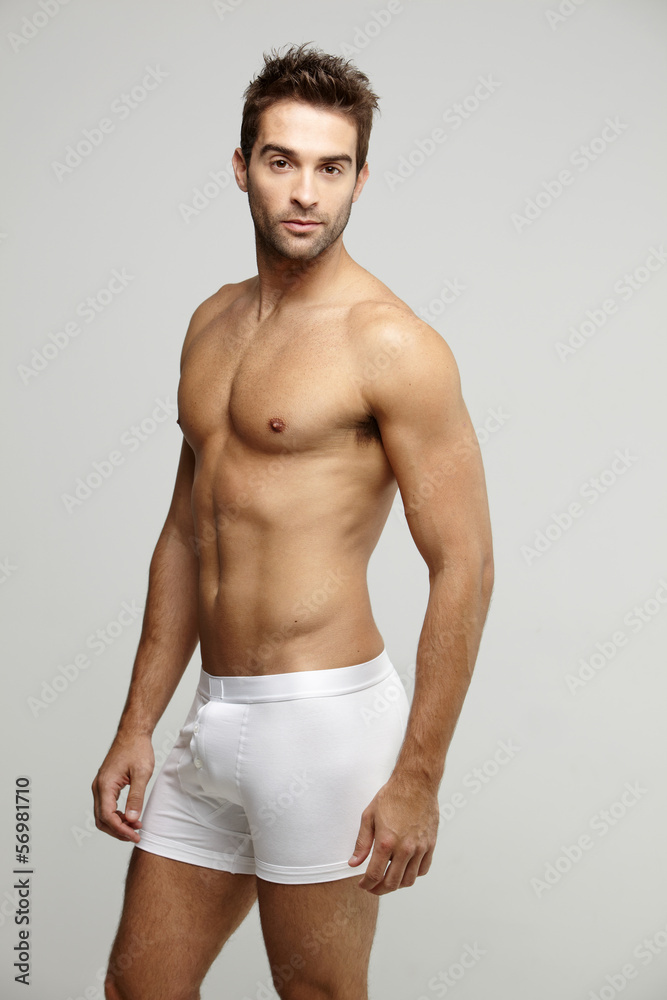 Portrait of mid adult man in underpants, studio shot