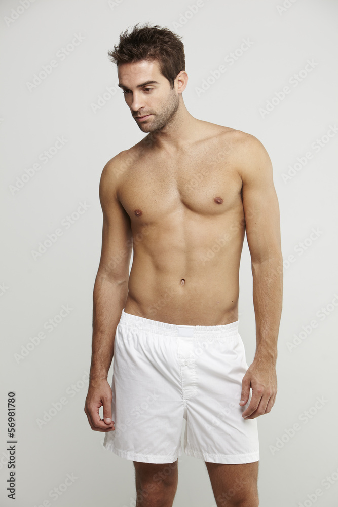 Portrait of mid adult man in boxer shorts