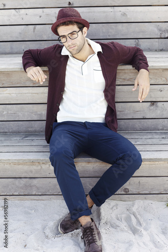 Portrait of mid adult man in trilby and cardigan