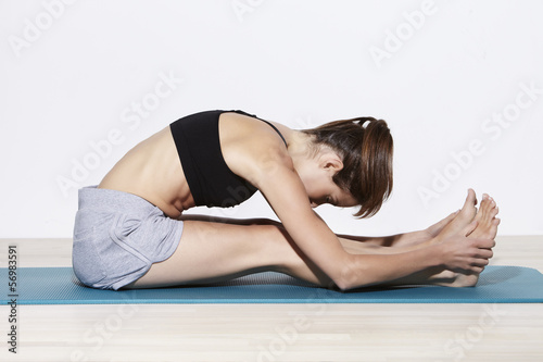 Young active woman training flexibility